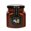 Sklenený pohár s gruzínskym medom zo gaštanov a lipy, označený ako 100% čistý gruzínsky produkt s hmotnosťou 350 g.